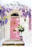 This Golders Green doorway scene captures the tender anticipation of stepping into a new home, wrapped in the gentle romance of flowers and soft colour. A pale pink front door, brushed in a muted, almost chalk-pastel hue, glows in the natural daylight, the kind you might notice wandering past quiet terraces near Golders Hill Park. Overhead and to the side, abundant strands of wisteria drape in loose, fragrant falls, their blossoms painted in delicate shades of lavender and lilac, each cluster tumbling down like a curtain of petals. The surrounding whitewashed walls act as a serene backdrop, subtly textured and sun-kissed, with a matching shutter carrying just a blush of pink that ties the composition together. On the doorstep, a vintage-style grey metal bucket holds a generous bouquet of creamy white roses, each bloom full and velvety, gathered closely together with hints of fresh green foliage peeking between them. A soft pink ribbon, tied neatly around the bucket, trails slightly onto the stone, its gentle sheen catching the light in echoes of the door's warm colour. The imagined scent is a soothing blend of classic rose and sweet wisteria, mingling with fresh outdoor air. It feels like a thoughtful housewarming gift delivered to a newly moved couple settling just off Hoop Lane, a quiet gesture that says welcome without needing any words. Every detail - from the pastel tones and cascading flowers to the simple bucket and satin bow - combines to create an atmosphere of calm optimism, perfect for marking new beginnings with beauty, grace, and heartfelt warmth.